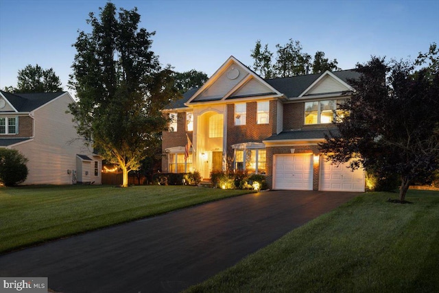 9308 Eagle Ct, Manassas Park, VA 20111 - view of front of home with a garage, driveway, and a front yard