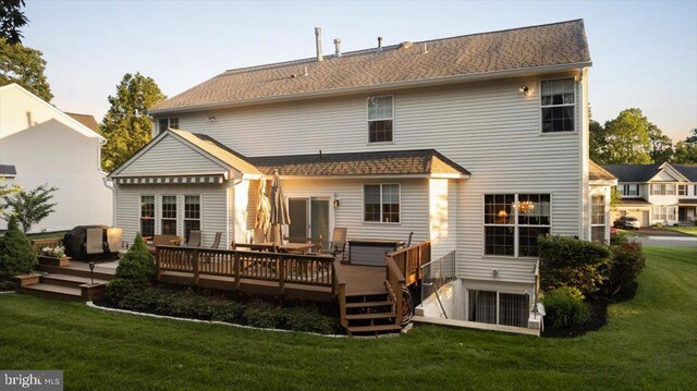 9308 Eagle Ct, Manassas Park, VA 20111 - back of property with a deck and a lawn