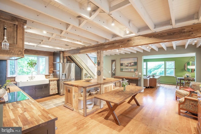 448 Old Dublin Pike, Doylestown, PA 18901 - dining room featuring light wood-style floors, healthy amount of natural light, stairway, track lighting, and wood ceiling with exposed beams