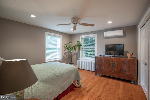 448 Old Dublin Pike, Doylestown, PA 18901 - bedroom with radiator heating unit, a wall mounted AC, light wood finished floors, recessed lighting, and ceiling fan