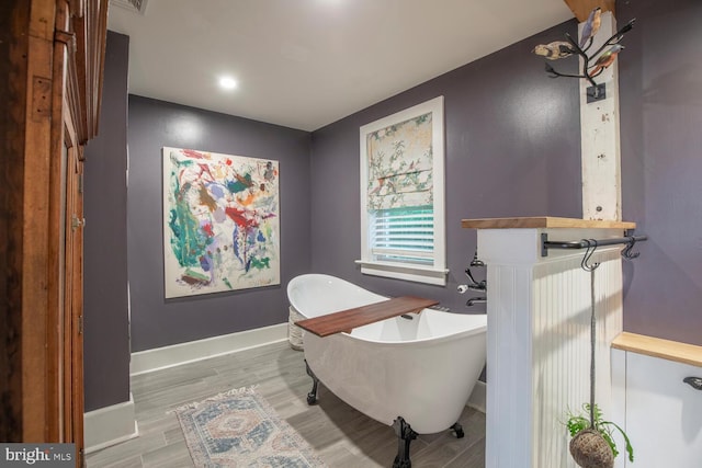 448 Old Dublin Pike, Doylestown, PA 18901 - full bath featuring a freestanding tub, wood finished floors, and baseboards