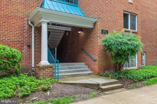 11833 Shire Ct Unit 12C, Reston, VA 20191 - doorway to property featuring a standing seam roof, brick siding, and metal roof