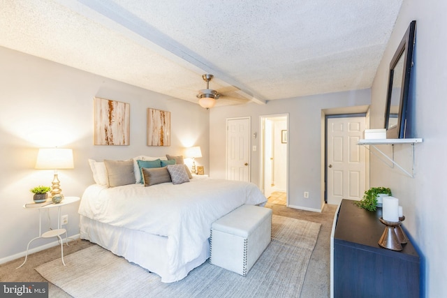 11833 Shire Ct Unit 12C, Reston, VA 20191 - bedroom featuring light colored carpet, a textured ceiling, baseboards, and ceiling fan