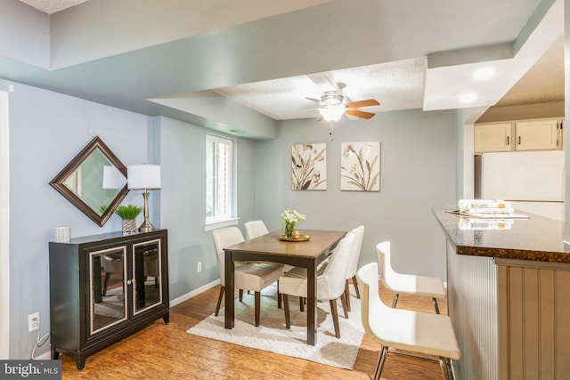 11833 Shire Ct Unit 12C, Reston, VA 20191 - dining area with light wood-style floors, ceiling fan, and baseboards