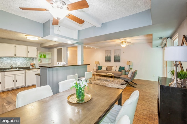 11833 Shire Ct Unit 12C, Reston, VA 20191 - dining space featuring ceiling fan, light wood-style floors, a textured ceiling, and baseboards