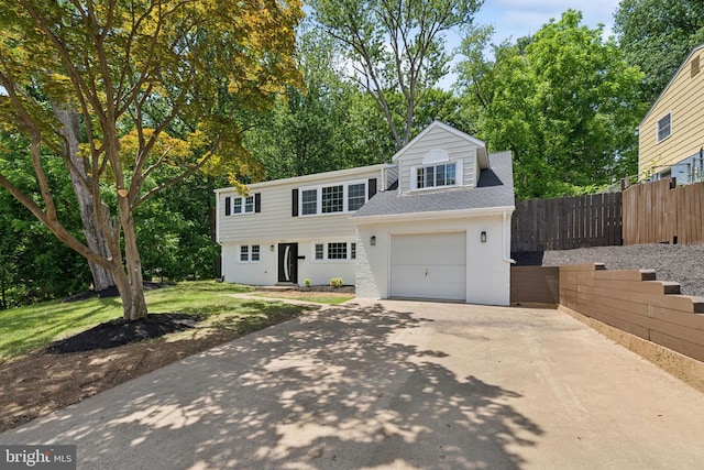 3521 Forestdale Ave, Woodbridge, VA 22193 - view of front of property featuring driveway, a garage, view of scattered trees, and a shingled roof