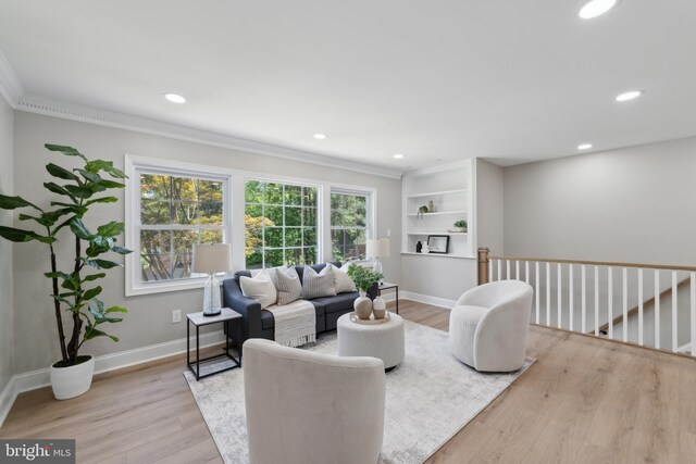 3521 Forestdale Ave, Woodbridge, VA 22193 - living room featuring crown molding, light wood-type flooring, recessed lighting, baseboards, and built in features