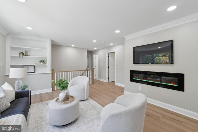 3521 Forestdale Ave, Woodbridge, VA 22193 - living room featuring wood finished floors, recessed lighting, a glass covered fireplace, baseboards, and crown molding