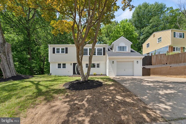 3521 Forestdale Ave, Woodbridge, VA 22193 - view of front of home featuring concrete driveway, a garage, and view of scattered trees
