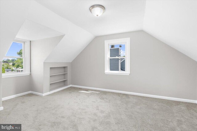 200 S Longcross Rd, Linthicum Heights, MD 21090 - additional living space featuring built in features, carpet, lofted ceiling, and baseboards