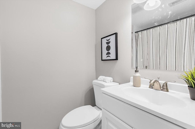 200 S Longcross Rd, Linthicum Heights, MD 21090 - bathroom with toilet, vanity, and curtained shower
