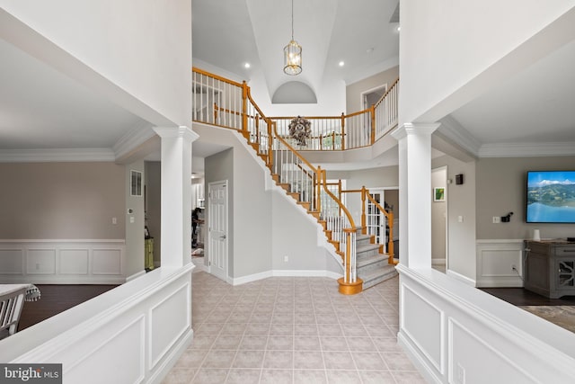 34905 Gidney Ct, Round Hill, VA 20141 - entryway with ornate columns, stairs, crown molding, a high ceiling, and a decorative wall