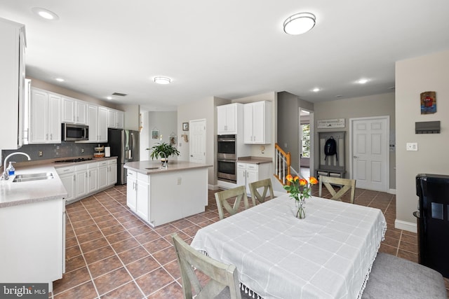 34905 Gidney Ct, Round Hill, VA 20141 - tiled dining room featuring a sink, recessed lighting, and baseboards