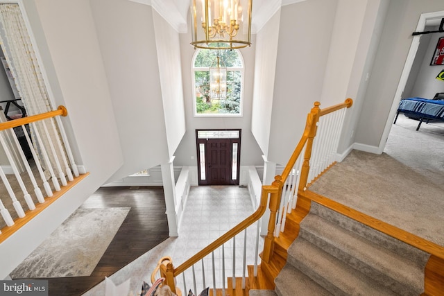 34905 Gidney Ct, Round Hill, VA 20141 - foyer entrance featuring a high ceiling, a chandelier, stairs, and baseboards