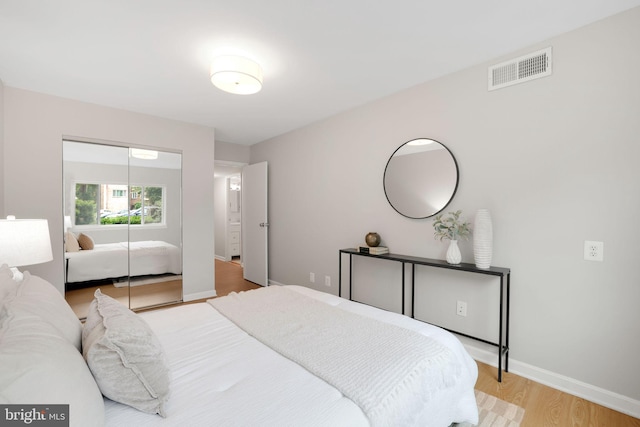 5041 7th Rd S Unit 102, Arlington, VA 22204 - bedroom featuring wood finished floors, baseboards, and a closet
