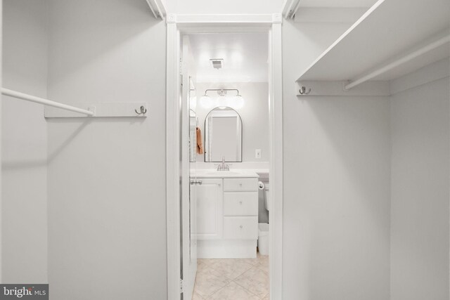 5041 7th Rd S Unit 102, Arlington, VA 22204 - spacious closet featuring light tile patterned flooring and a sink