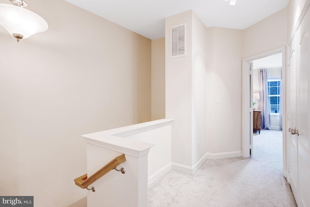 2505 Basin View Ln, Woodbridge, VA 22191 - hall featuring an upstairs landing, light colored carpet, and baseboards