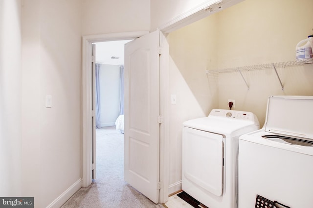 2505 Basin View Ln, Woodbridge, VA 22191 - laundry area with washer and dryer, light colored carpet, and baseboards