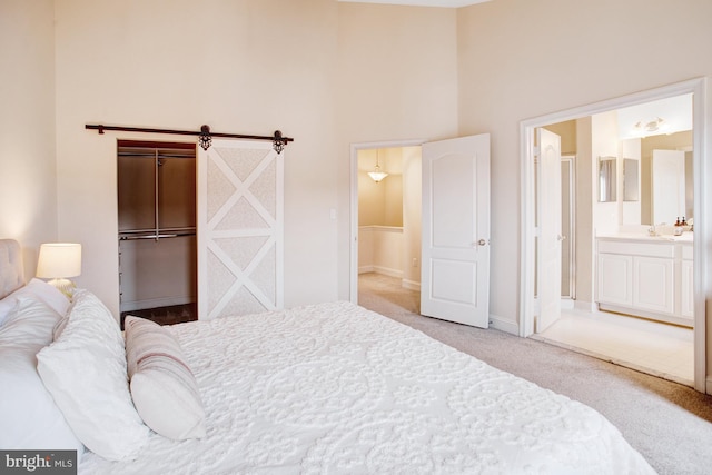 2505 Basin View Ln, Woodbridge, VA 22191 - bedroom with carpet, a high ceiling, baseboards, connected bathroom, and a spacious closet