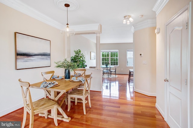 2505 Basin View Ln, Woodbridge, VA 22191 - dining room with light wood-type flooring, crown molding, and baseboards