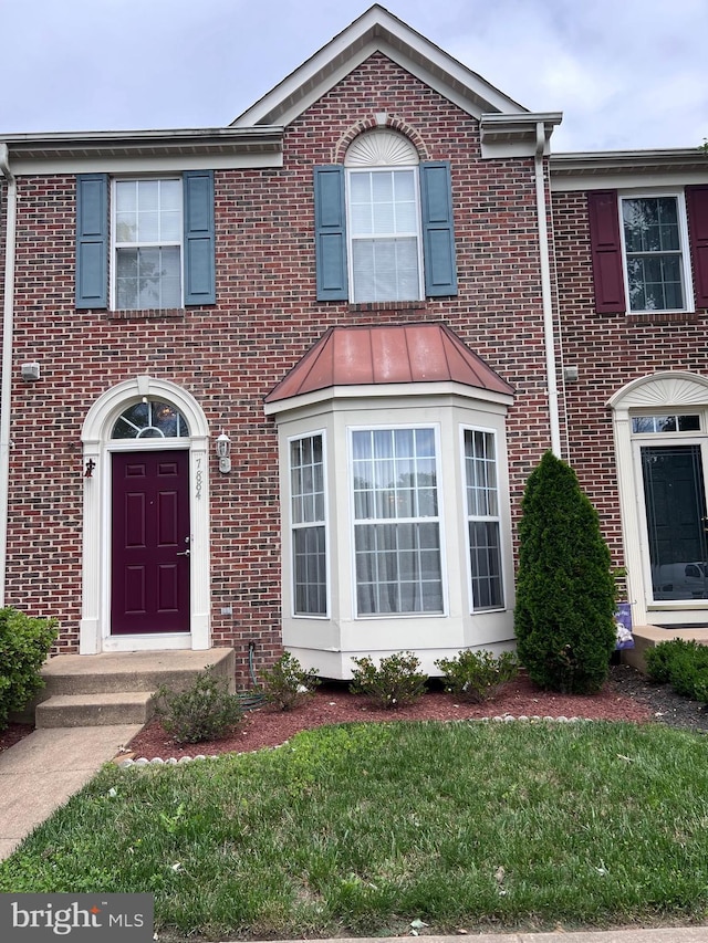 7884 Seafarer Way, Lorton, VA 22079 - view of front of house with brick siding and a front lawn