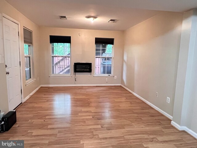 7884 Seafarer Way, Lorton, VA 22079 - unfurnished living room featuring light wood finished floors and baseboards