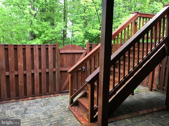 7884 Seafarer Way, Lorton, VA 22079 - wooden terrace with a gate, stairs, and a wooded view