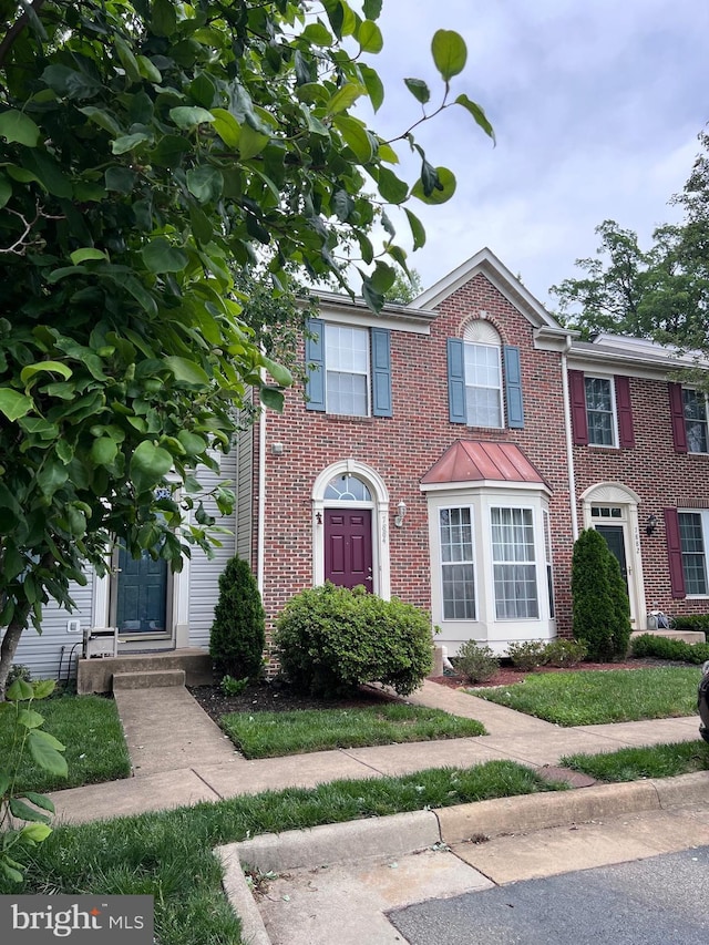 7884 Seafarer Way, Lorton, VA 22079 - view of front of home featuring brick siding and a standing seam roof