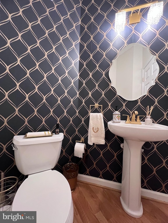 7884 Seafarer Way, Lorton, VA 22079 - half bathroom featuring baseboards, wallpapered walls, toilet, and wood finished floors