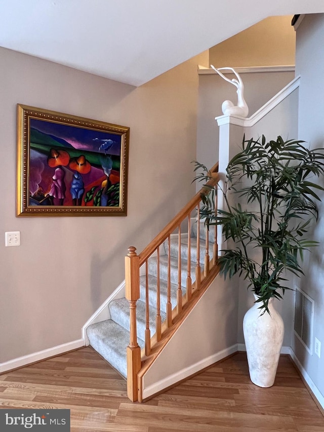 7884 Seafarer Way, Lorton, VA 22079 - stairs with wood finished floors and baseboards