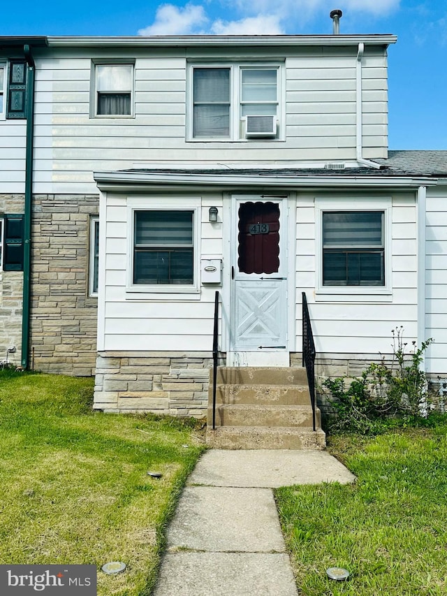 413 S Andrews Ave, Glenolden, PA 19036 - view of property with entry steps, a front yard, and stone siding