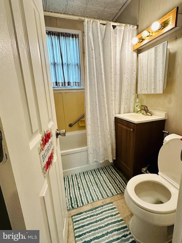 413 S Andrews Ave, Glenolden, PA 19036 - full bath featuring toilet, tile patterned flooring, shower / bath combo with shower curtain, wood walls, and vanity