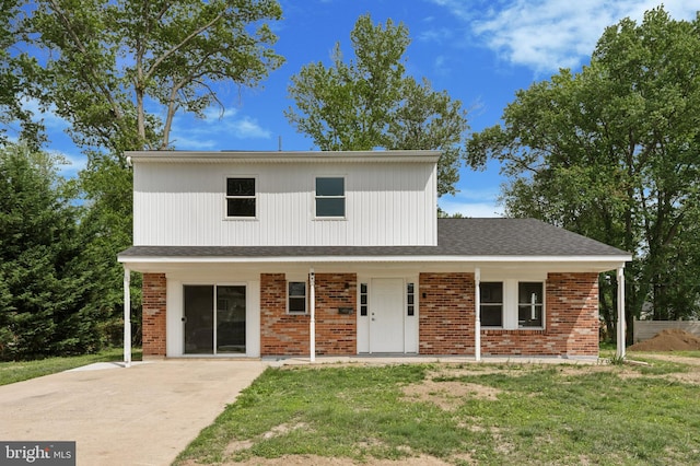 37 Anglin Dr, Newark, DE 19713 - traditional-style home with brick siding, a front yard, and a porch