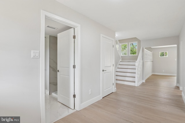 37 Anglin Dr, Newark, DE 19713 - hallway with baseboards, light wood finished floors, and stairway