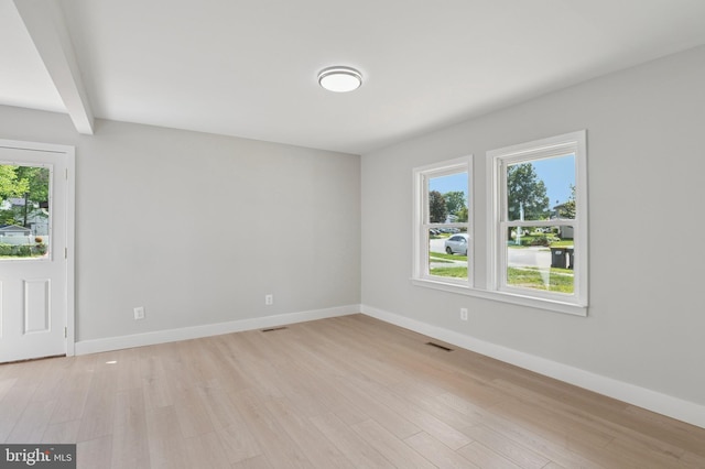 37 Anglin Dr, Newark, DE 19713 - spare room with plenty of natural light, light wood finished floors, baseboards, and beamed ceiling
