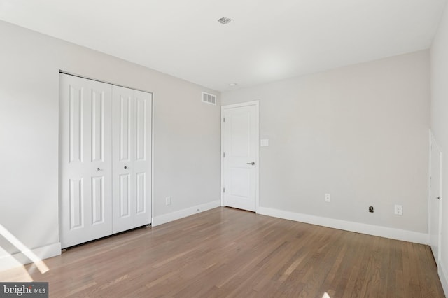 37 Anglin Dr, Newark, DE 19713 - unfurnished bedroom featuring wood finished floors, baseboards, and a closet
