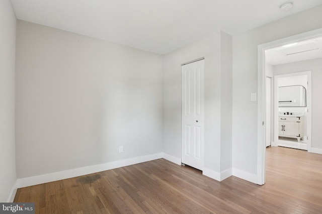 37 Anglin Dr, Newark, DE 19713 - unfurnished bedroom with wood finished floors, baseboards, and a closet