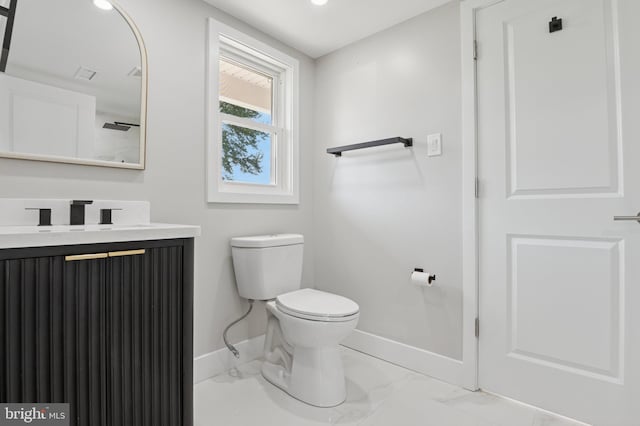 37 Anglin Dr, Newark, DE 19713 - bathroom featuring baseboards, toilet, vanity, marble look tile flooring, and recessed lighting