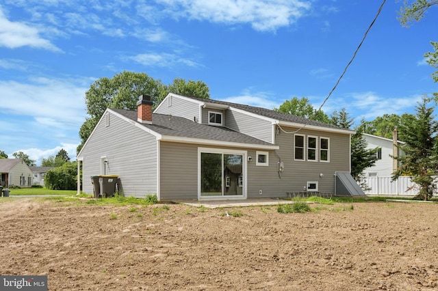 37 Anglin Dr, Newark, DE 19713 - back of property featuring a chimney and roof with shingles
