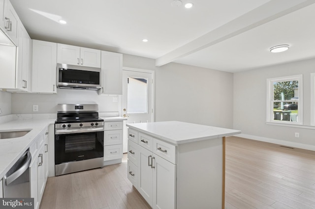 37 Anglin Dr, Newark, DE 19713 - kitchen with appliances with stainless steel finishes, light wood-style floors, light stone counters, white cabinetry, and recessed lighting