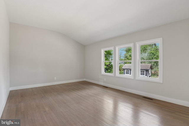 37 Anglin Dr, Newark, DE 19713 - empty room with baseboards, wood finished floors, and lofted ceiling