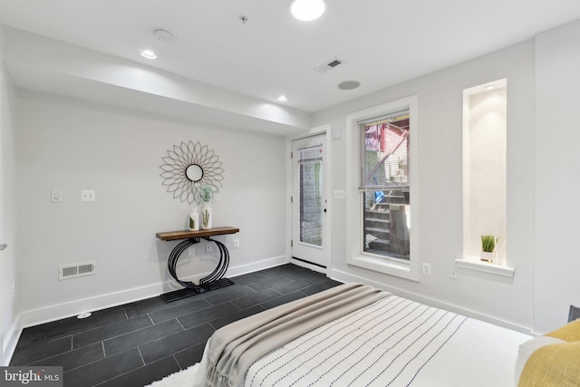 652 L St NE Unit 1, Washington, DC 20002 - bedroom with access to exterior, baseboards, dark tile patterned flooring, and recessed lighting