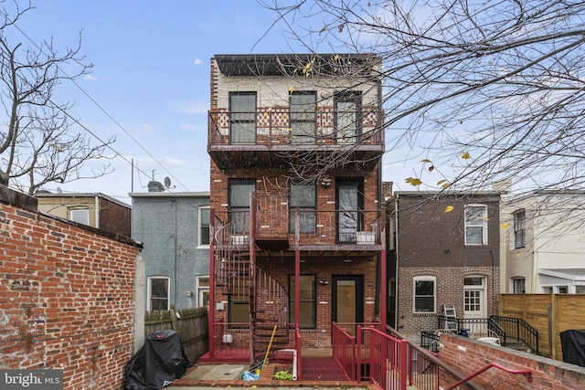 652 L St NE Unit 1, Washington, DC 20002 - back of property featuring a balcony and brick siding