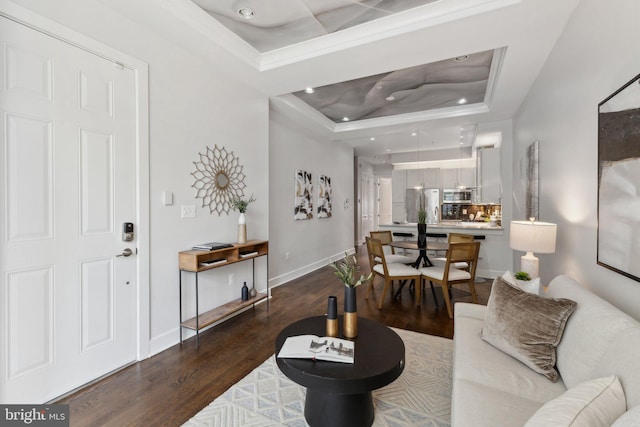 652 L St NE Unit 1, Washington, DC 20002 - living area with a raised ceiling, wood finished floors, baseboards, recessed lighting, and crown molding