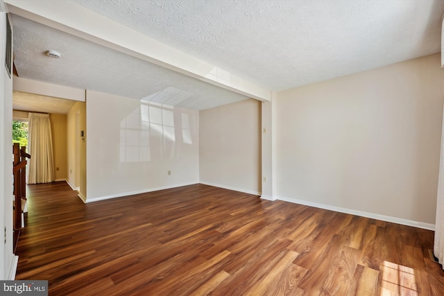 19256 Misty Meadow Ter, Germantown, MD 20874 - spare room featuring wood finished floors, baseboards, and a textured ceiling