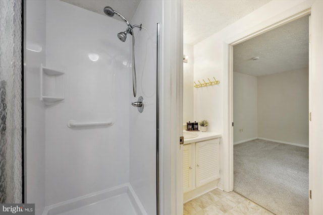 19256 Misty Meadow Ter, Germantown, MD 20874 - full bath with a stall shower, vanity, a textured ceiling, and baseboards