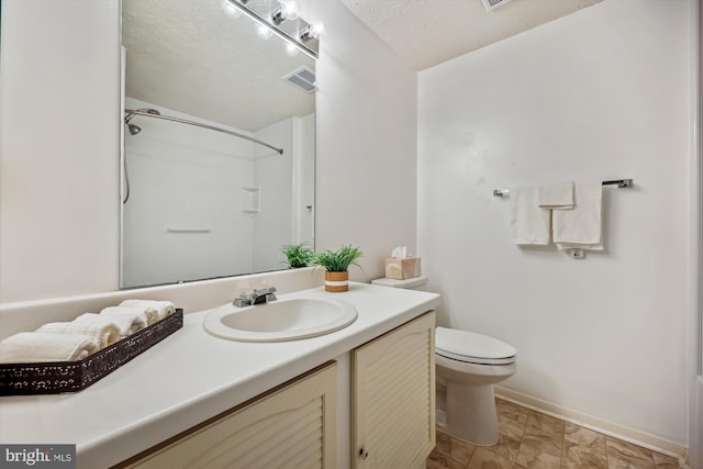 19256 Misty Meadow Ter, Germantown, MD 20874 - bathroom featuring vanity, toilet, baseboards, a shower, and a textured ceiling