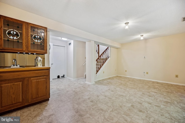 19256 Misty Meadow Ter, Germantown, MD 20874 - empty room with stairway, baseboards, light floors, and bar