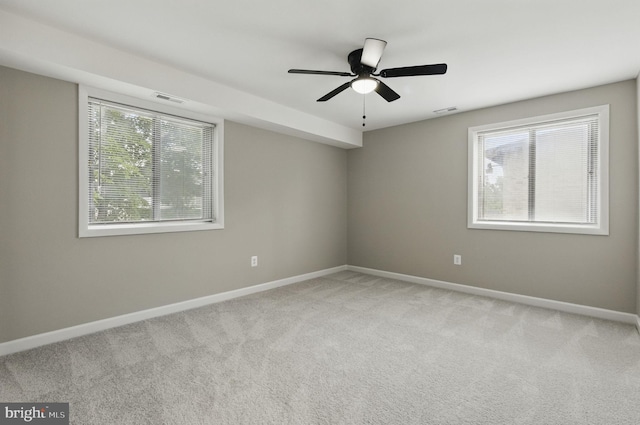 2310 Ewing Ave Unit 203, Suitland, MD 20746 - carpeted empty room featuring healthy amount of natural light and ceiling fan