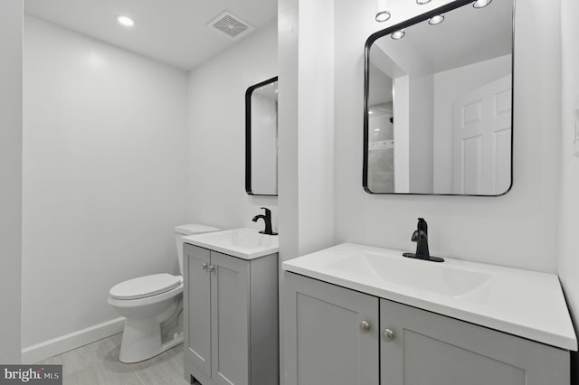 2310 Ewing Ave Unit 203, Suitland, MD 20746 - bathroom featuring two vanities and recessed lighting
